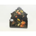 Papier mâché black lacquer wall pocket with polychrome decoration of chrysanthemums, 9½" high.
