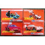 4 Revel Evolution Diecast sports cars. 3 Ferraris & 1 GT Ford. Mint boxed.