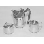 Three pieces of Piquot Ware, comprising: hot water jug; covered sugar bowl & milk jug.