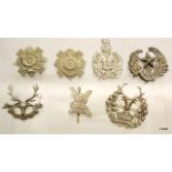 Seven Scottish military cap badges