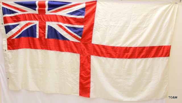 An original Royal Navy white ensign flag 55 inches by 110 inches