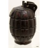 An inert No.36M Mark 1 Mills Bomb hand grenade which retains much of its original shellac coating