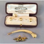 A 14ct gold Royal Artillery Sweetheart brooch and gold mounted claw and also 4 x 18ct gold studs