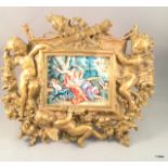 A bronze Art Nouveau style frame inset with enamel plaque of figures in classical pose stamped