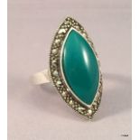 A silver and jade marcasite dress ring