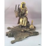 A cold painted bronze of an Arab holding a goats head