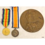 A WW1 Memorial Plaque named to John Adams with a WW1 pair of medals named to M-408406 Private AC