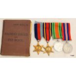 A WW2 pay book and medals belonging to 5887892 Private JW Houghton of the Corps of Signals