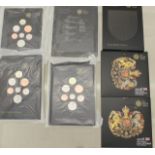A collection of UK emblems of Britain Shield of Arms coin sets