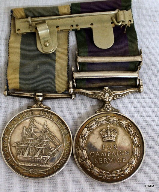 A mounted medal pair consisting of a General Service Medal with Malay ...