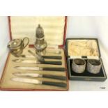 A pair of Oriental silver napkin rings, a silver sugar sifter and other items