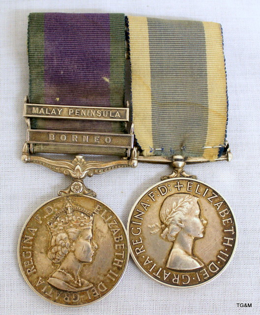 A mounted medal pair consisting of a General Service Medal with Malay ...