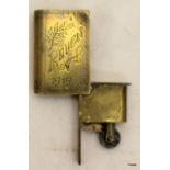 A WW1 trench art petrol lighter disguised as a miniature book with engraving Rouen 1919