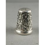 A silver embossed thimble