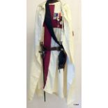 A Knights Templar complete Masonic regalia consisting of Smock, Hooded Cape, Sash, Sword (made by AR