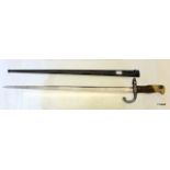 A French Gras Bayonet 52cm blade dated 1876 wooden grip brass pommel complete with metal scabbard.