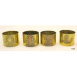 Four WW1 French trench art souvenir napkin rings named to La Somme, Pau, Bailleul & Doullens