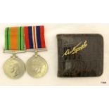 A mounted WW2 medal pair awarded to Anne Studholme of the Womens Royal Naval Service with her