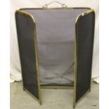 A tri-fold brass & wire fire guard