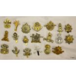 A quantity of British military cap badges