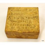 A late 19th to early 20th century German Colonial Empire wooden box with carved into the lid it