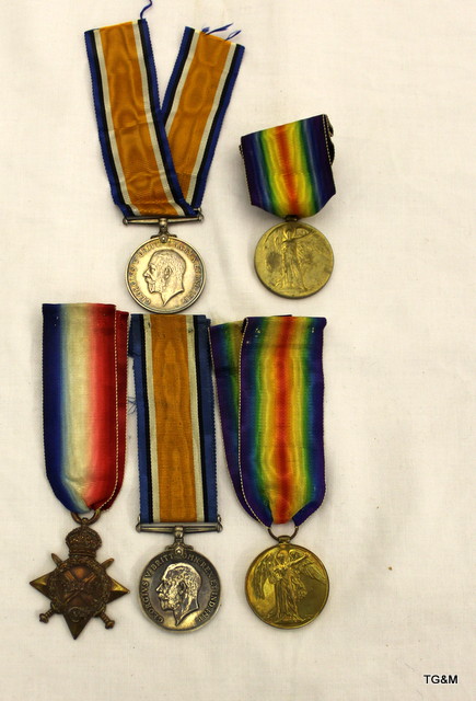 A WW1 medal trio named to T4-124298 Private S Jones of the Army Service Corps and a WW1 medal pair