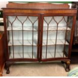 A mahogany glazed display case on ball and claw feet 123 x 121 x 35