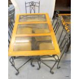 An iron framed glass and wood topped table and 6 iron framed chairs 76 x 147 x 88cm