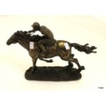 A Bronzed figurine of a race horse