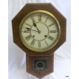 A Mahogany Cased Wall Clock complete with Key