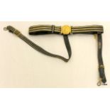 An early 20th century Royal Navy Flag Officers dress sword belt with hanging straps. Made by