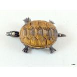 An unusual pearl set turtle brooch