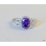 A Silver CZ and Amethyst Dress Ring.