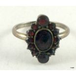 A Ladies Garnet and silver ring size U