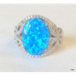 A Silver CZ and Opal Dress Ring.