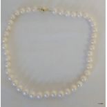 A Fine Cultured Pearl Necklace With Silver Gilt Clasp.