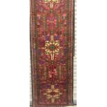 An Axminster Hall Runner Red/Blue/Burgundy 370 x 72 cm