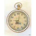 A brass cased decorative pocket watch