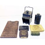 A quantity of WW2 military equipment including a bicycle lamp, anti gas eyeshields, water