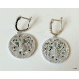 A pair of silver cz Cartier style panther earrings with emerald eyes