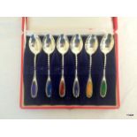 A boxed set of 6 enamel spoons