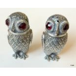 A pair of continental silver novelty owl condiments with glass eyes