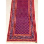 A Tabriz quality carpet repeated design in blue and red 420 x 107