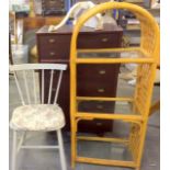 Mixed furniture items to include a chest of drawers, white painted chair and a cane display shelf