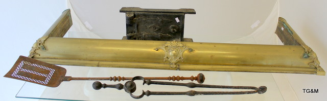 A brass fire fender, iron fire tongs and shovel and a small bread oven door