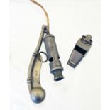 An Air Raids Precautions ARP whistle with an Air Ministry whistle and a Military marked Royal Navy
