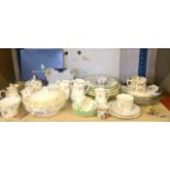 A shelf full of miscellaneous China items