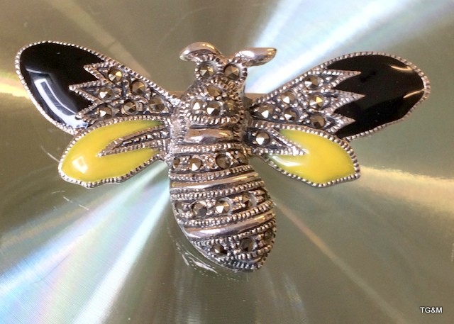 A silver and plique-a-jour bug brooch