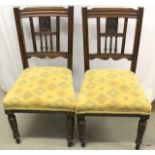 A pair of Edwardian dining chairs