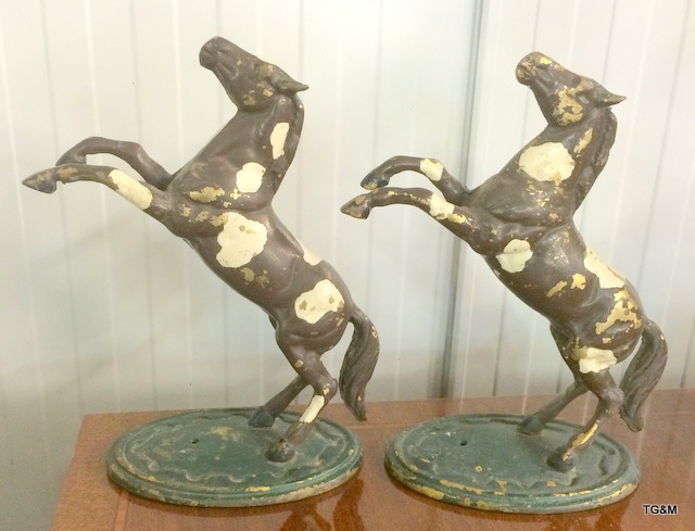 A pair of metal rearing horses